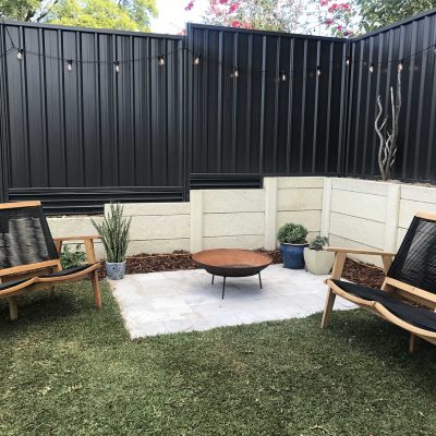 Best Vinyl black steel fence in backyard around fire pit